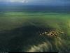 [B14 SLR: Yann Arthus-Bertrand] Village built on Tongcquil pilings